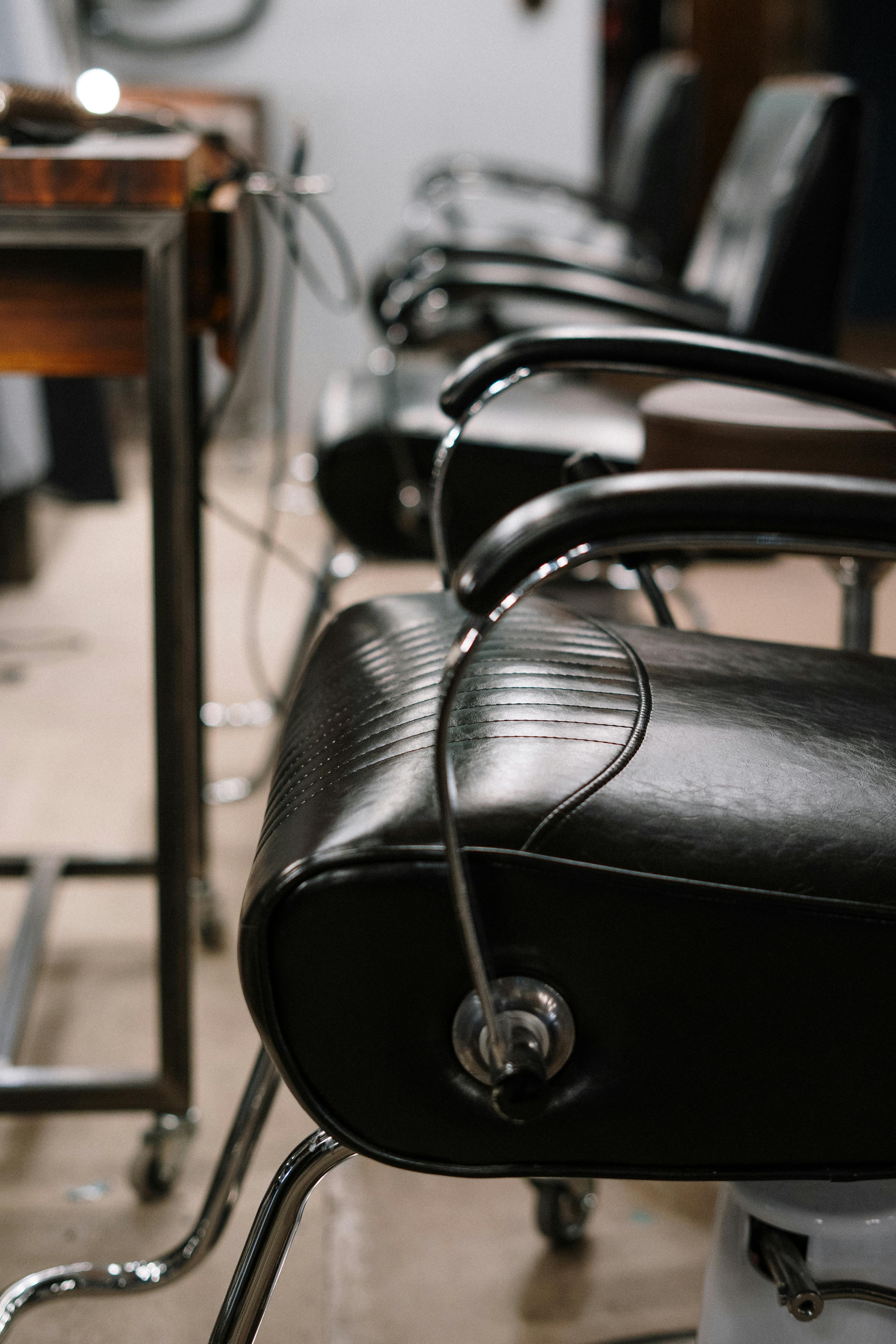 Row of black barber chairs